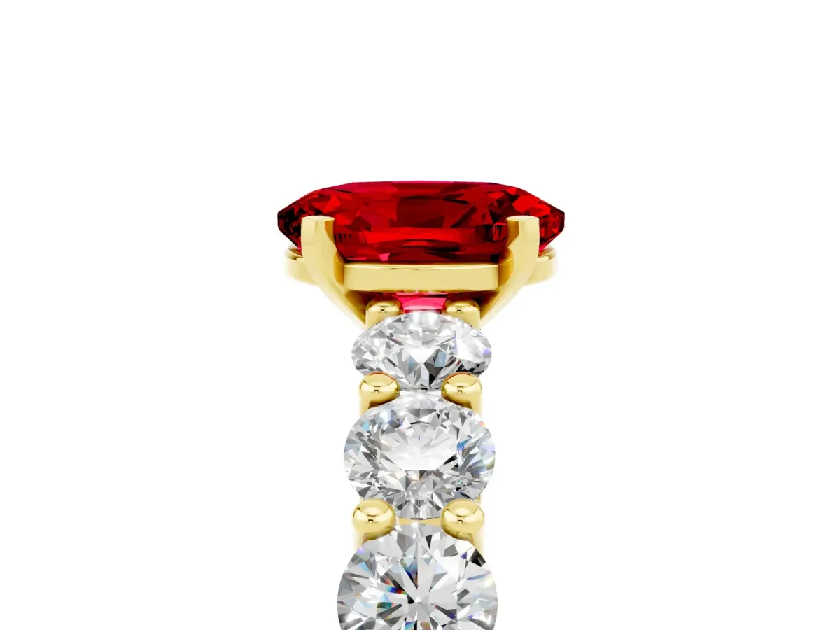 Oval Cut Ruby Prong Setting with Side Stones on a Pave Band Yellow gold