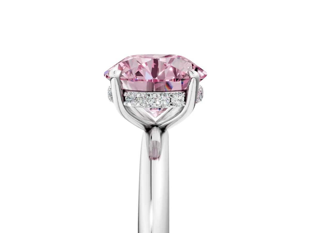 Fancy Pink Round Cut Diamond Solitaire Ring with Thin Band and Four-Prong Setting Silver