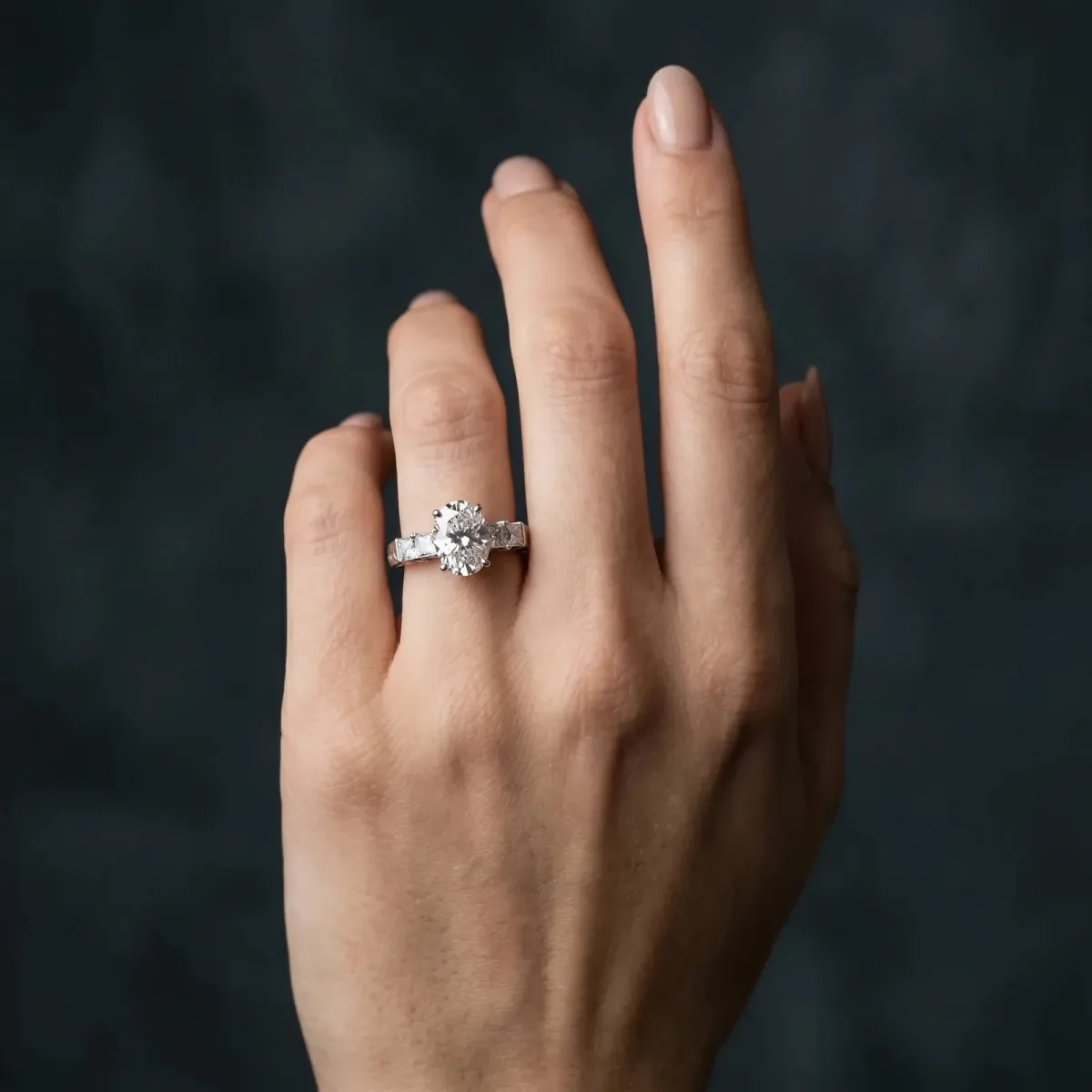 Oval Cut Solitaire Princess Side Stone Engraved Band Prong Setting Ring Platinum