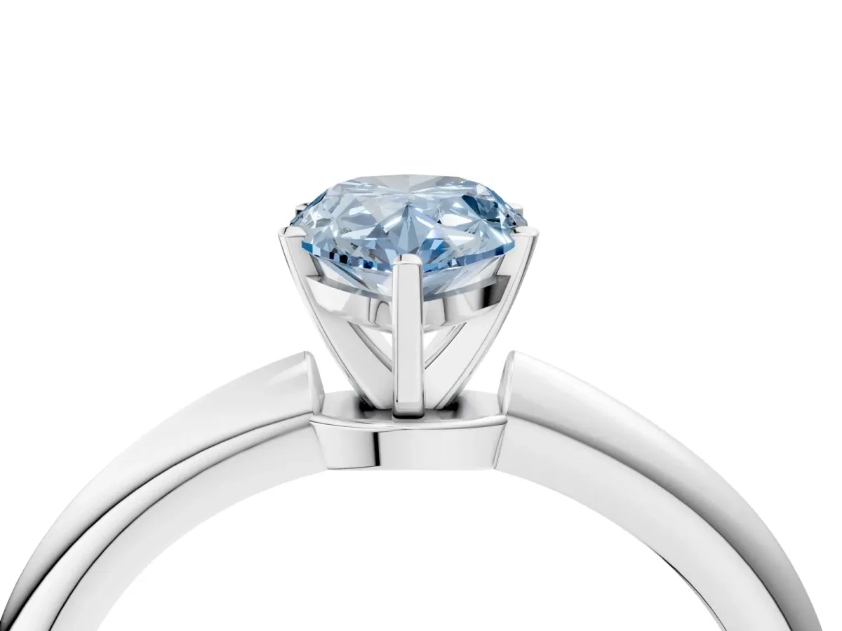Fancy Blue Pear Cut Diamond Solitaire Ring with Six-Prong Setting and Classic Band Silver