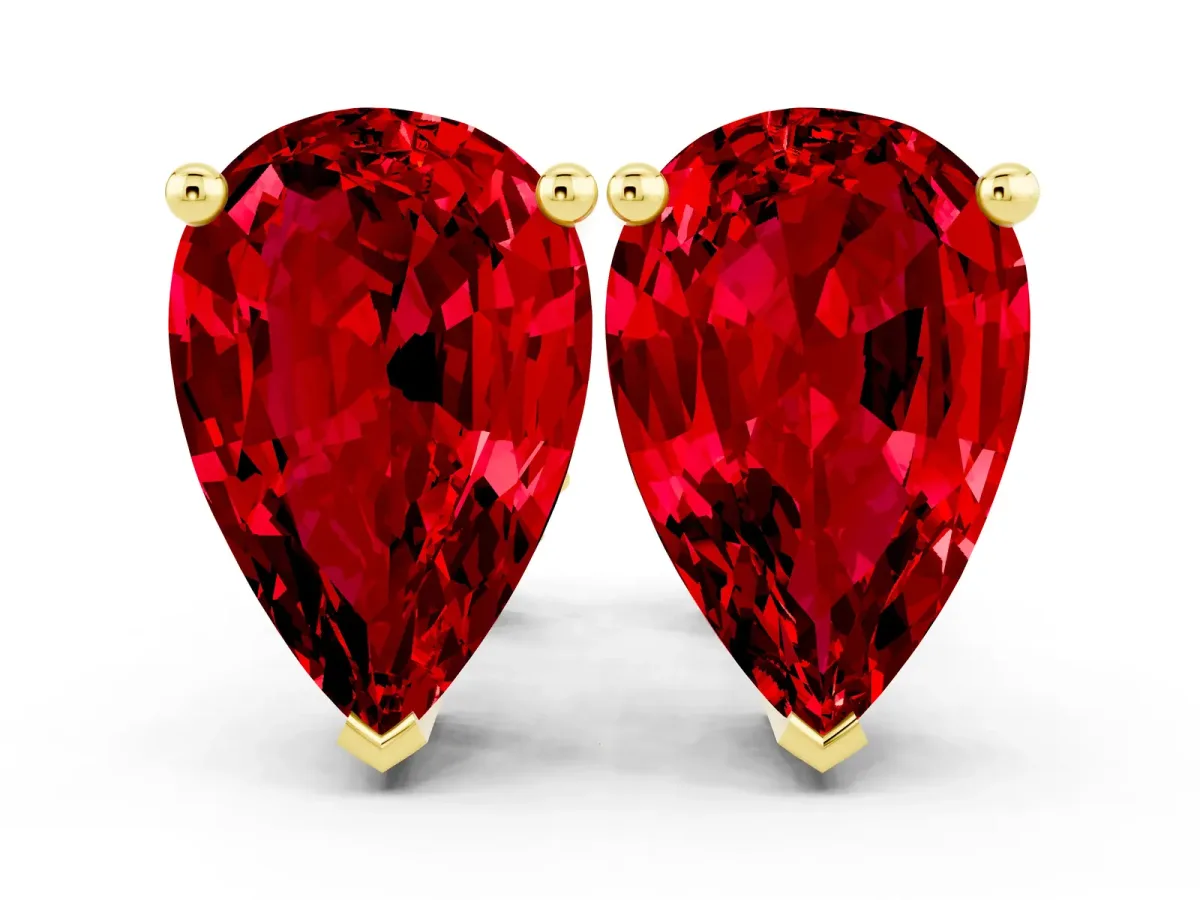 Pear Cut Ruby Stud Earrings Yellow gold