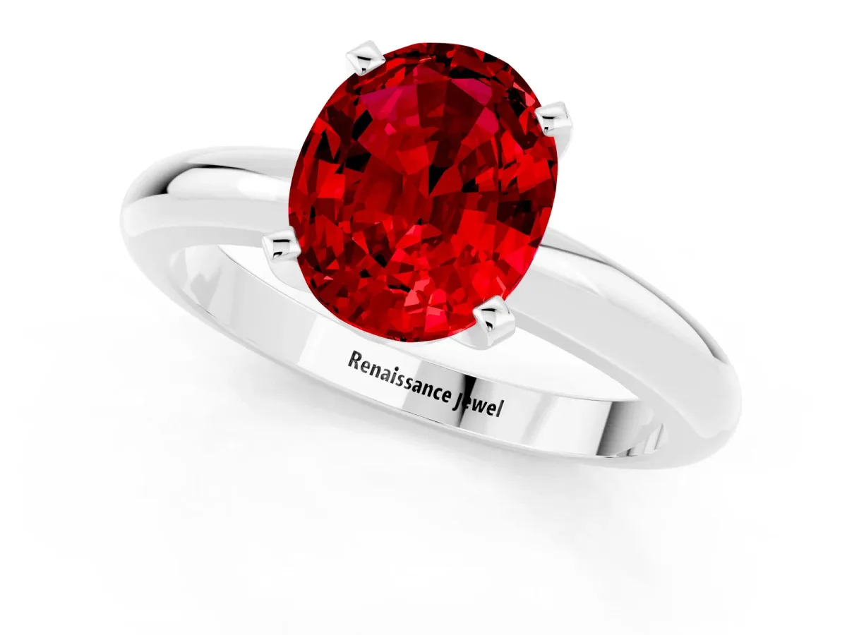 Oval Cut Ruby Solitaire Engagement Ring with Round Band and Four-Prong Setting Platinum