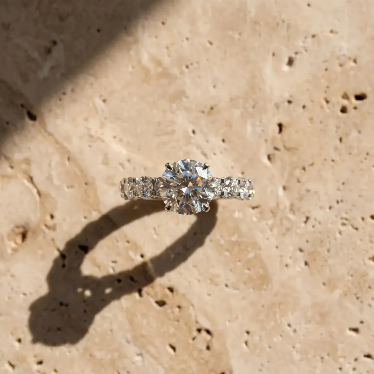 Round Cut Diamond Side Stone Engagement Ring with Four-Prong Setting Silver