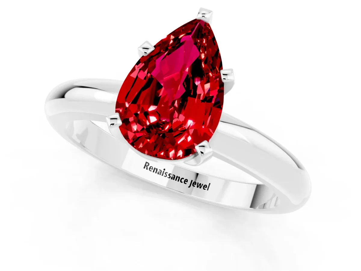 Pear Cut Ruby Solitaire Engagement Ring with Round Band and Four-Prong Setting Silver