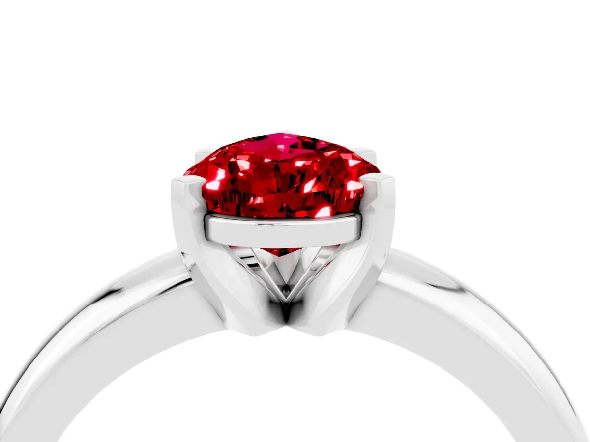Pear Cut Ruby Solitaire Engagement Ring with Round Band and Four-Prong Setting Silver