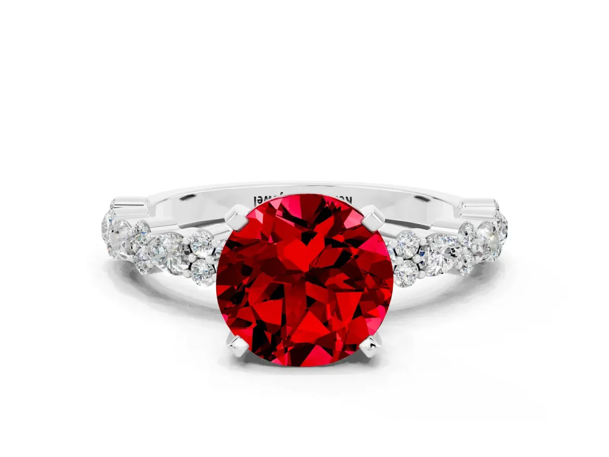 Round Cut Ruby Side Stone Solitaire Ring with Round and Four-Prong Setting Platinum