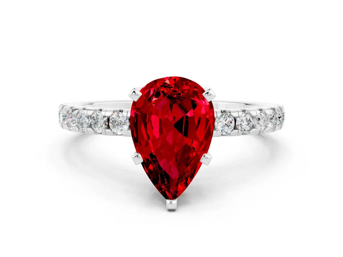 Pear Cut Ruby Solitaire Ring with Round Pavé Band and Four-Prong Setting White gold