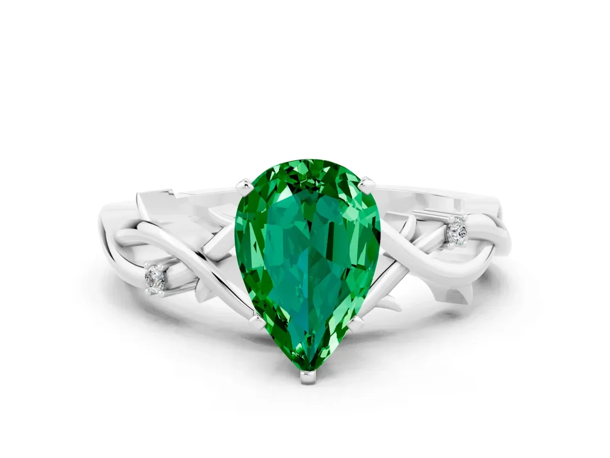Pear Cut Emerald Solitaire Ring with Twisted Band and Prong Setting Platinum