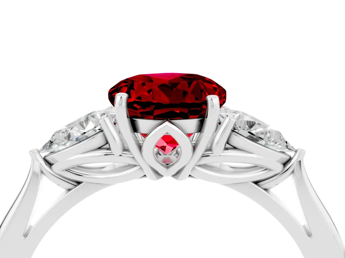 Three-Stone Round Cut Ruby Ring with Pear Side Stones in Four-Prong Setting Platinum