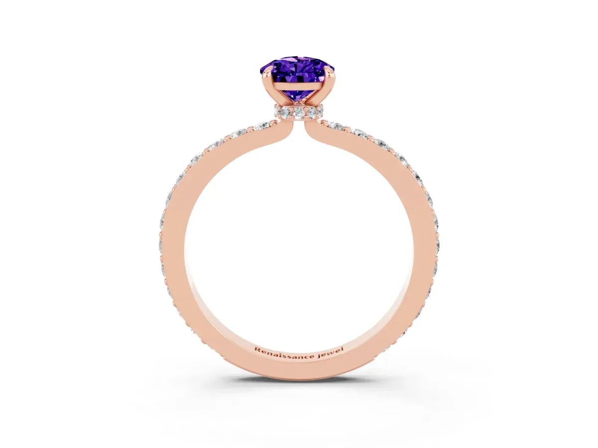 Pear Cut Tanzanite Solitaire Engagement Ring with Pavé Band and Four-Prong Setting Rose gold