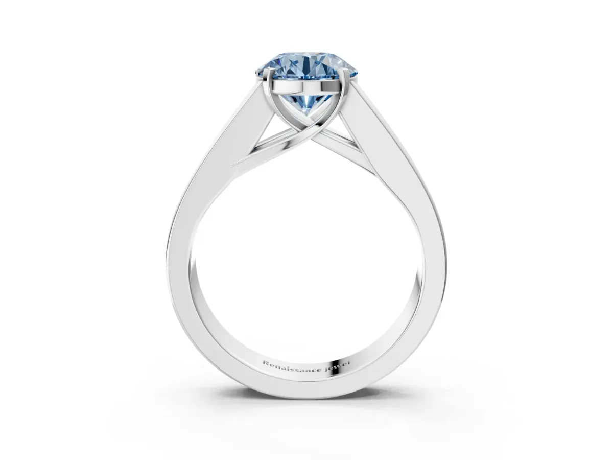 Fancy Blue Round Cut Cut Channel Set Solitaire Ring with Four-Prong Setting Silver