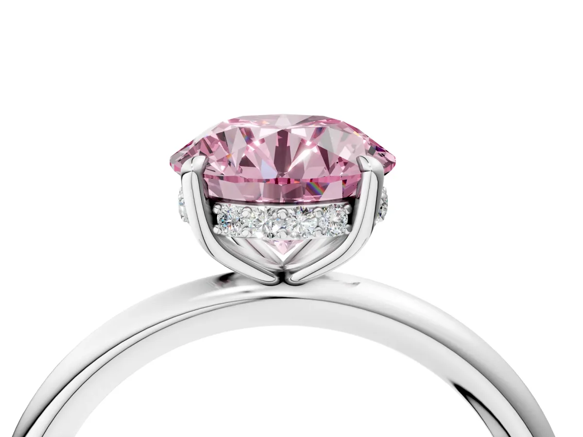 Fancy Pink Round Cut Diamond Solitaire Ring with Thin Band and Four-Prong Setting Silver