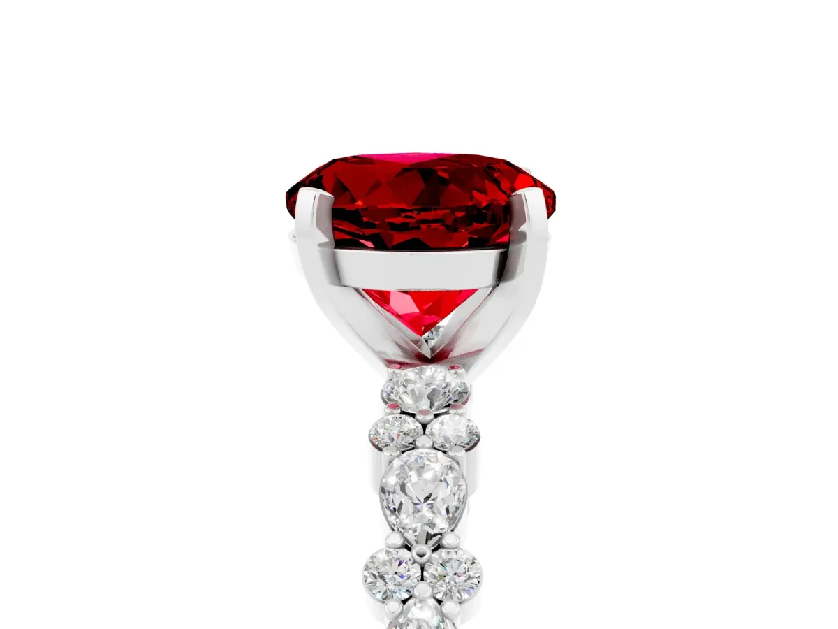 Round Cut Ruby Side Stone Solitaire Ring with Round and Four-Prong Setting Platinum
