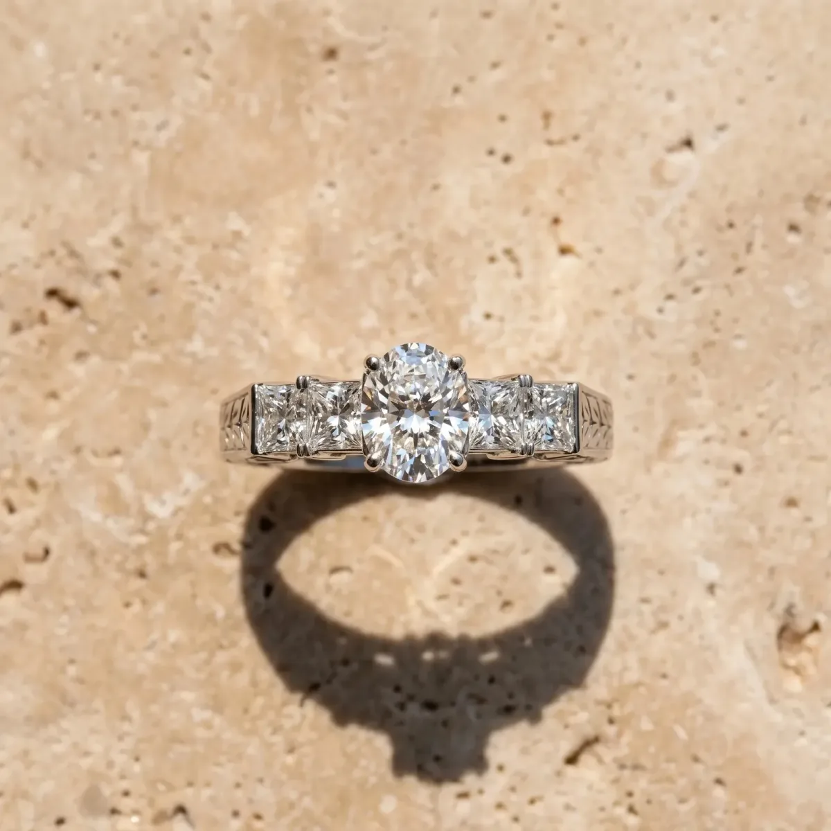 Oval Cut Solitaire Princess Side Stone Engraved Band Prong Setting Ring Platinum