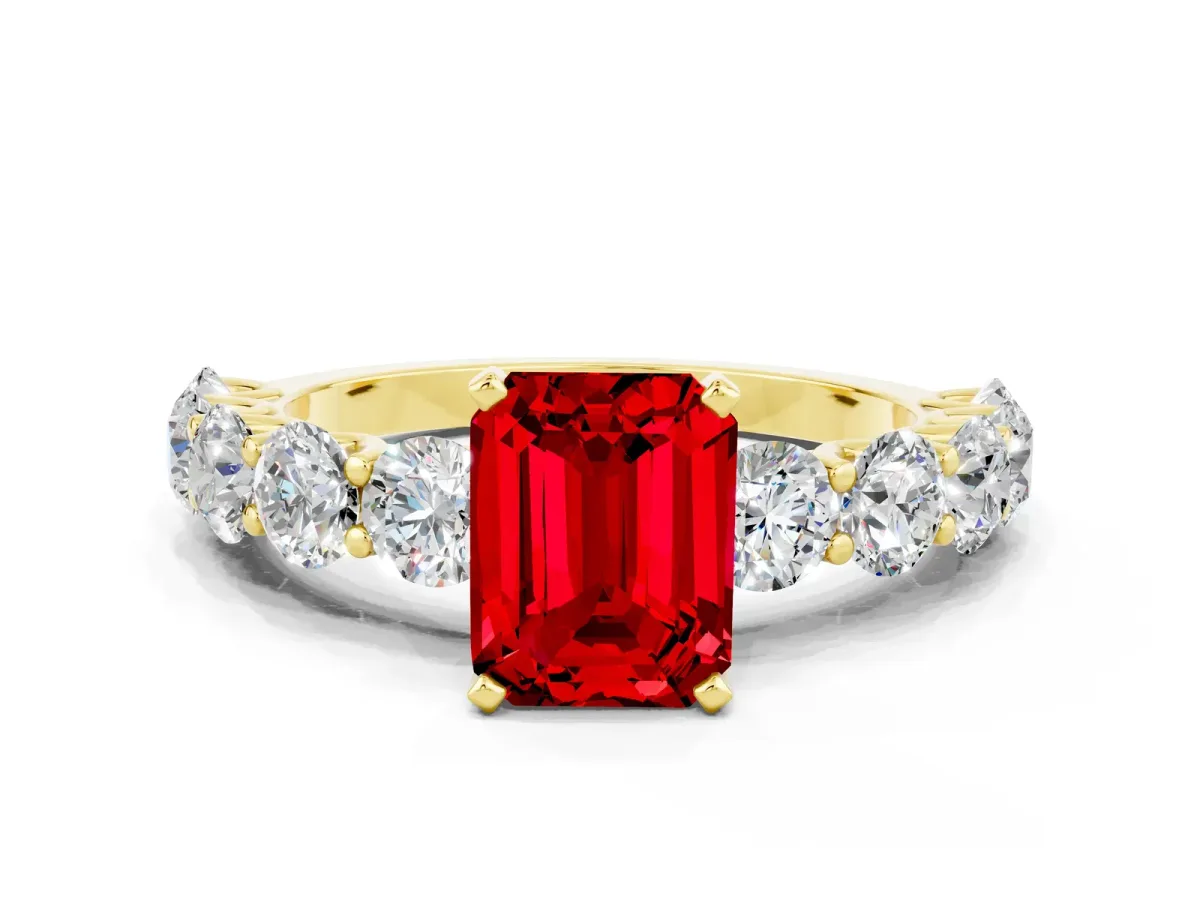 Emerald Cut Ruby Prong Setting with Side Stones on a Pave Band Yellow gold