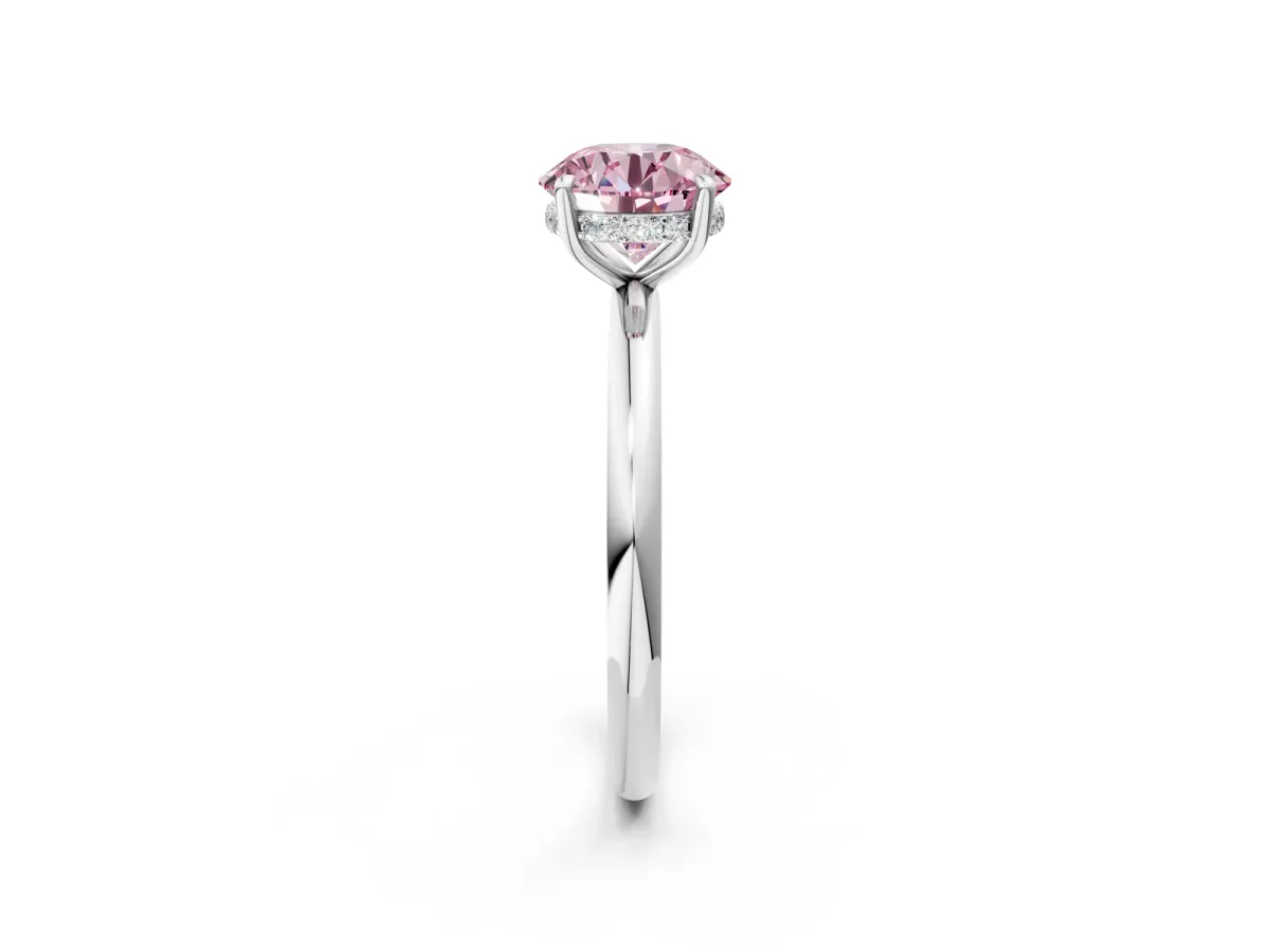 Fancy Pink Round Cut Diamond Solitaire Ring with Thin Band and Four-Prong Setting Silver