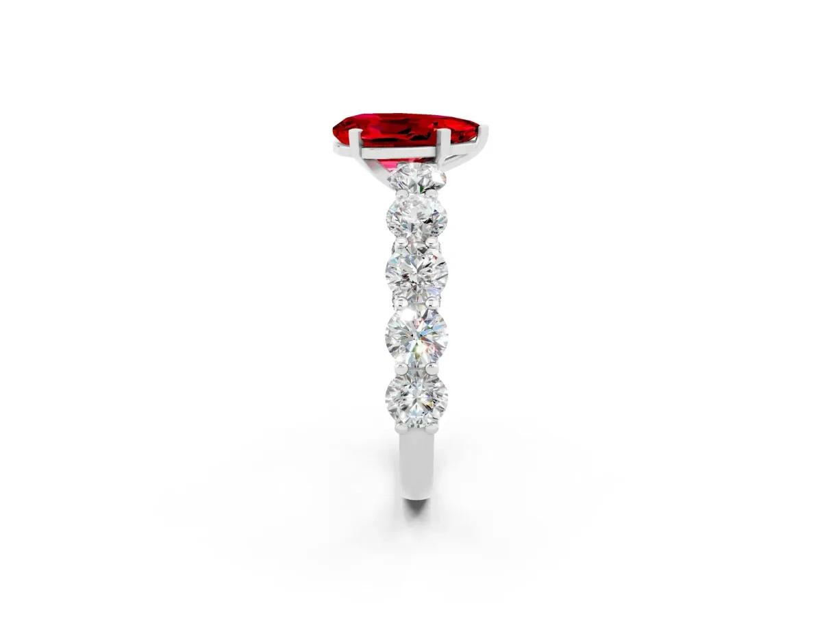 Pear Cut Ruby Prong Setting with Side Stones on a Pave Band Platinum