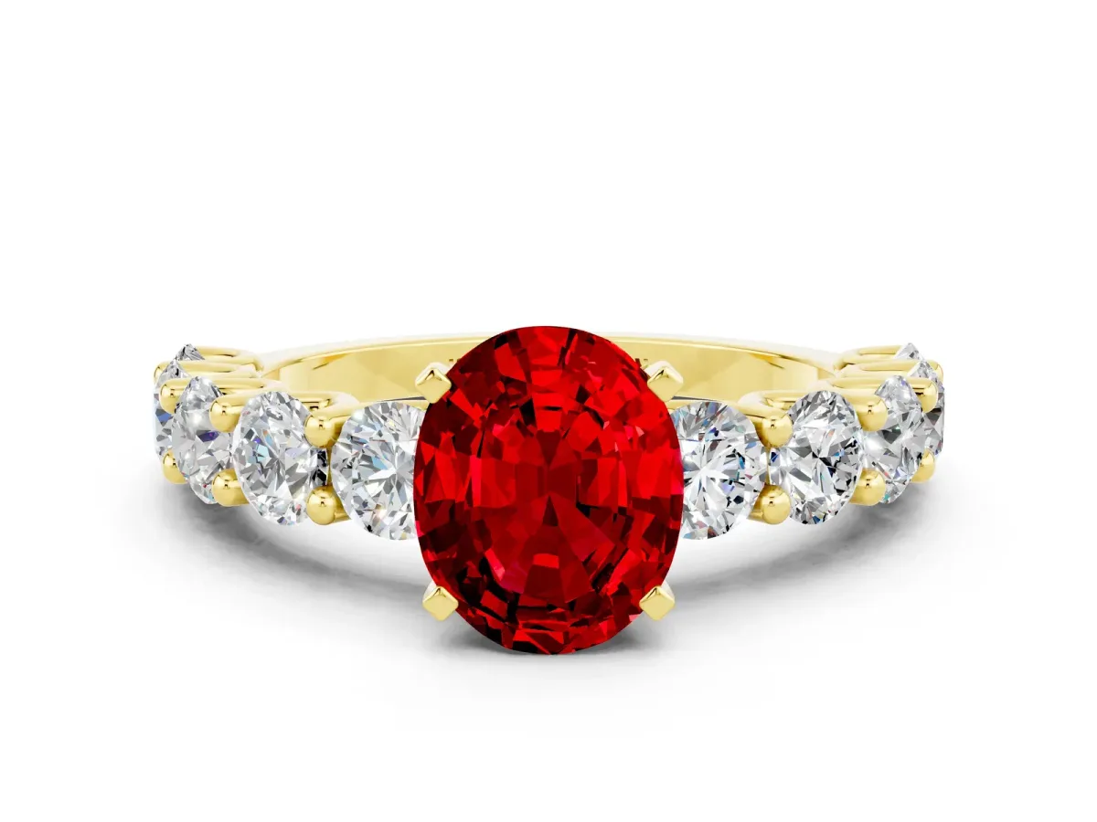 Oval Cut Ruby Prong Setting with Side Stones on a Pave Band Yellow gold