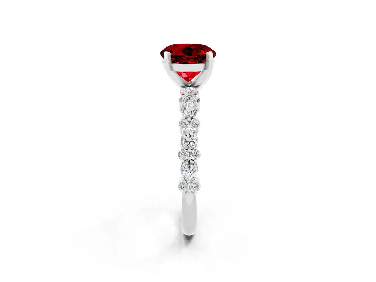 Round Cut Ruby Side Stone Solitaire Ring with Round and Four-Prong Setting Platinum