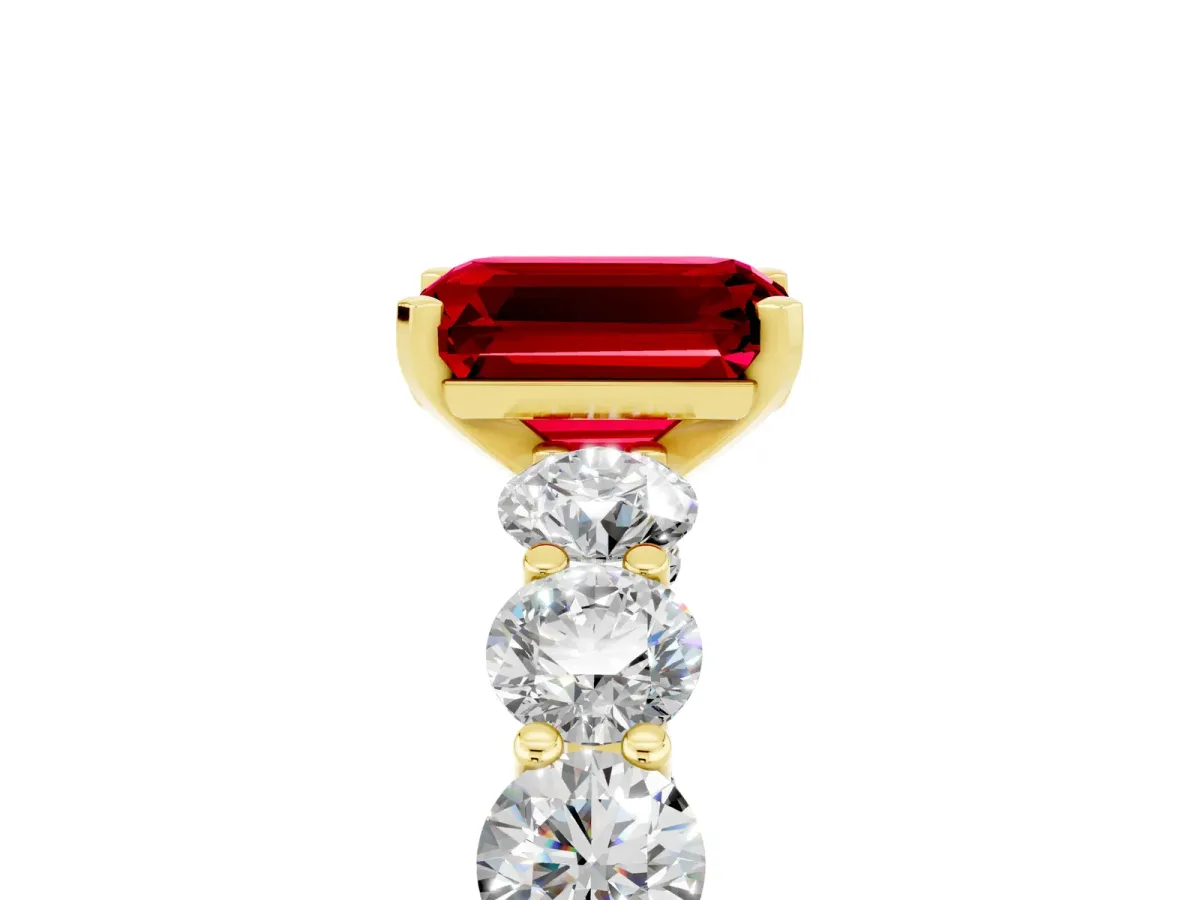 Emerald Cut Ruby Prong Setting with Side Stones on a Pave Band Yellow gold