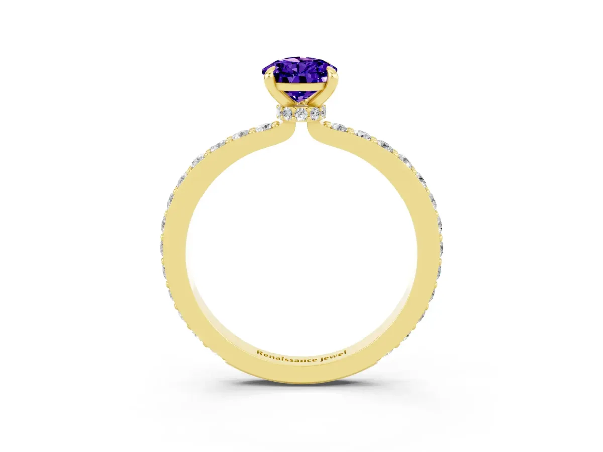 Pear Cut Tanzanite Solitaire Engagement Ring with Pavé Band and Four-Prong Setting Yellow gold