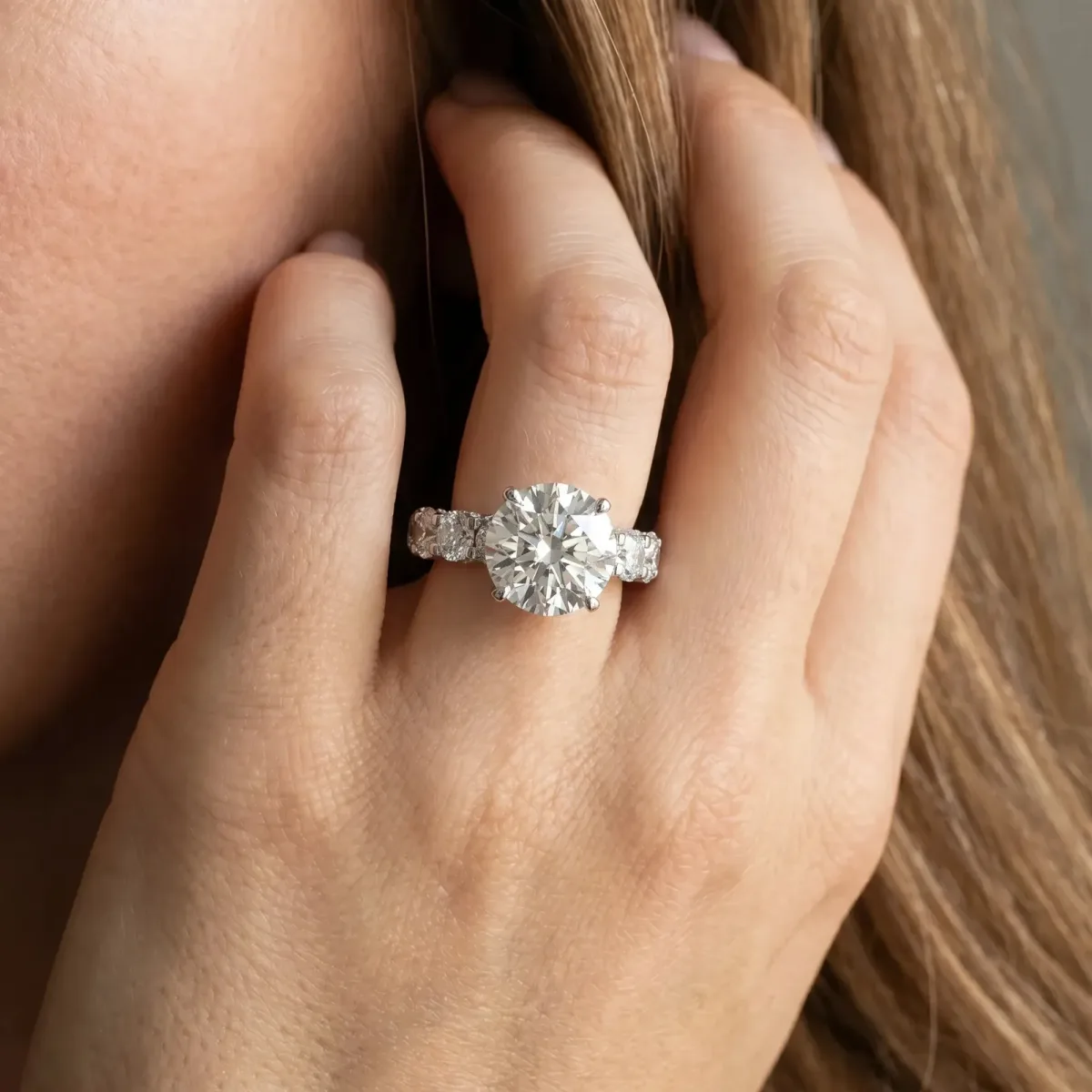 Round Cut Diamond Side Stone Engagement Ring with Four-Prong Setting Silver