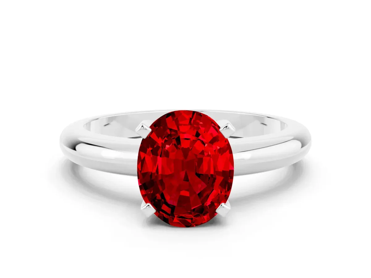Oval Cut Ruby Solitaire Engagement Ring with Round Band and Four-Prong Setting Platinum