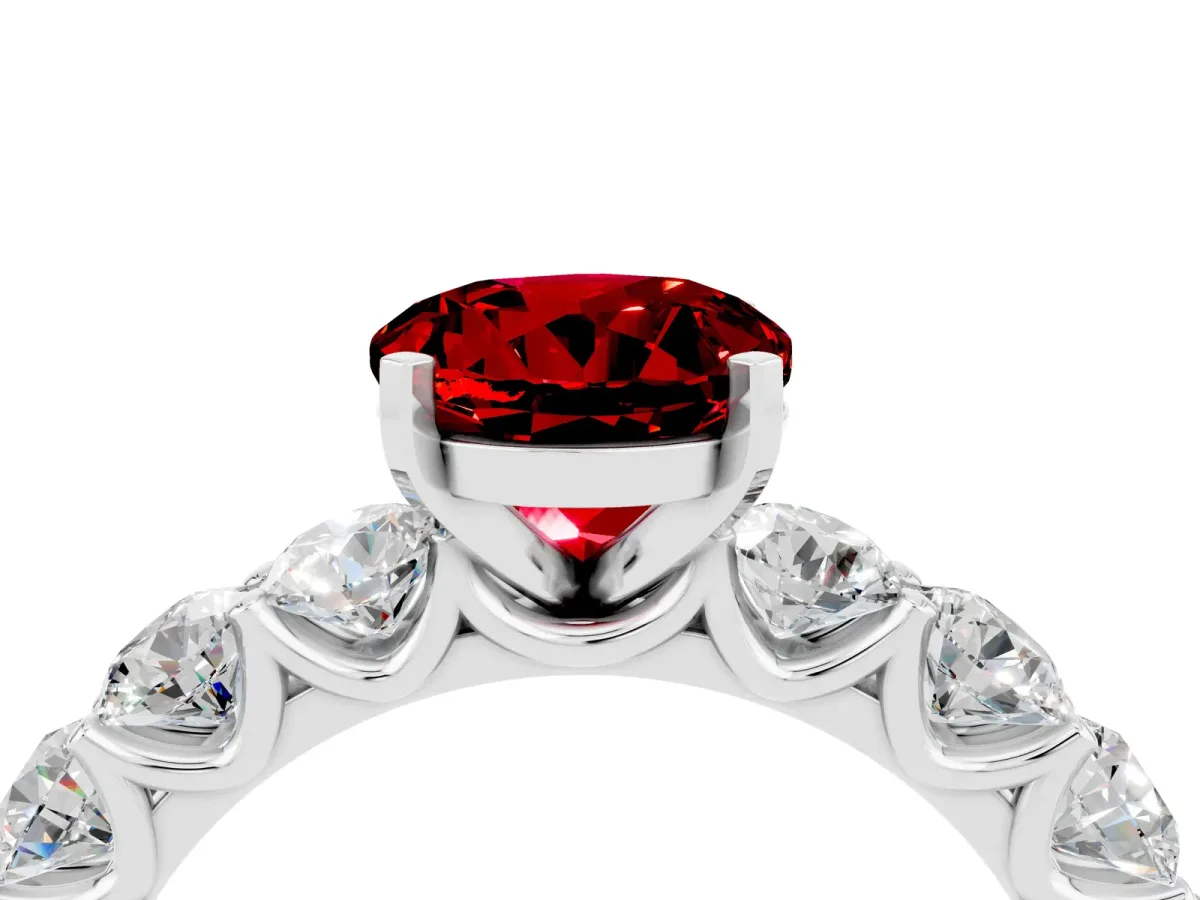 Round Cut Ruby Prong Setting with Side Stones on a Pave Band Silver