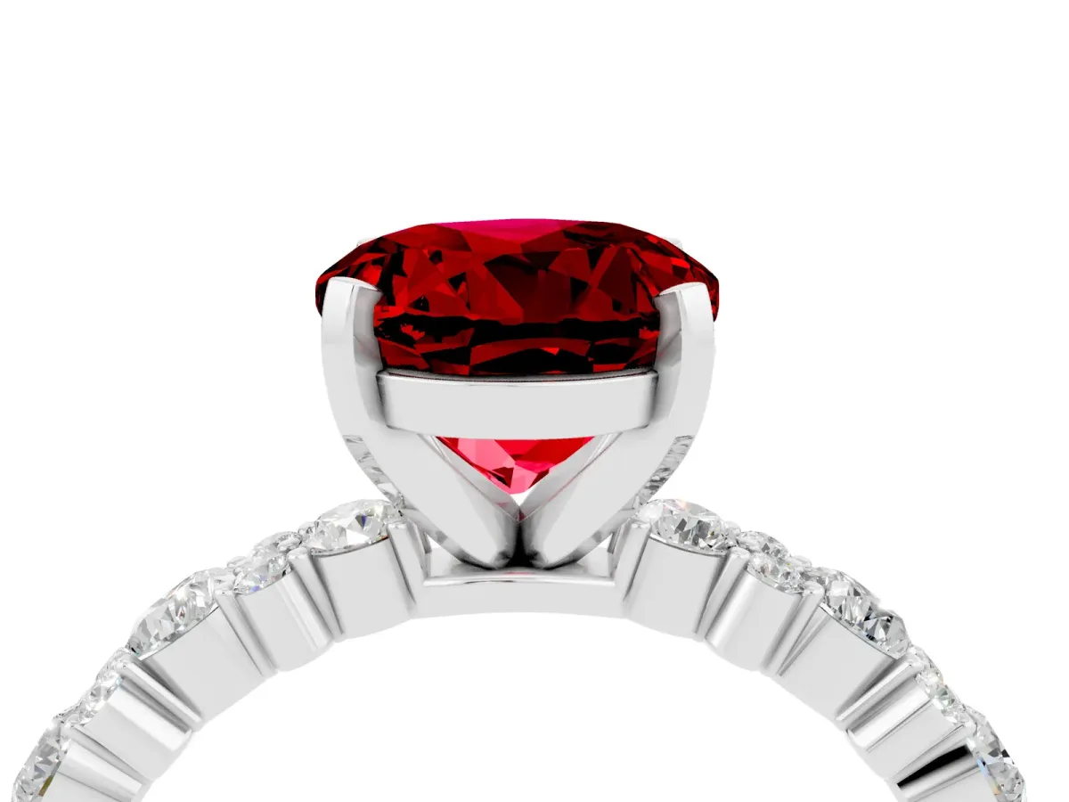 Round Cut Ruby Side Stone Solitaire Ring with Round and Four-Prong Setting Platinum