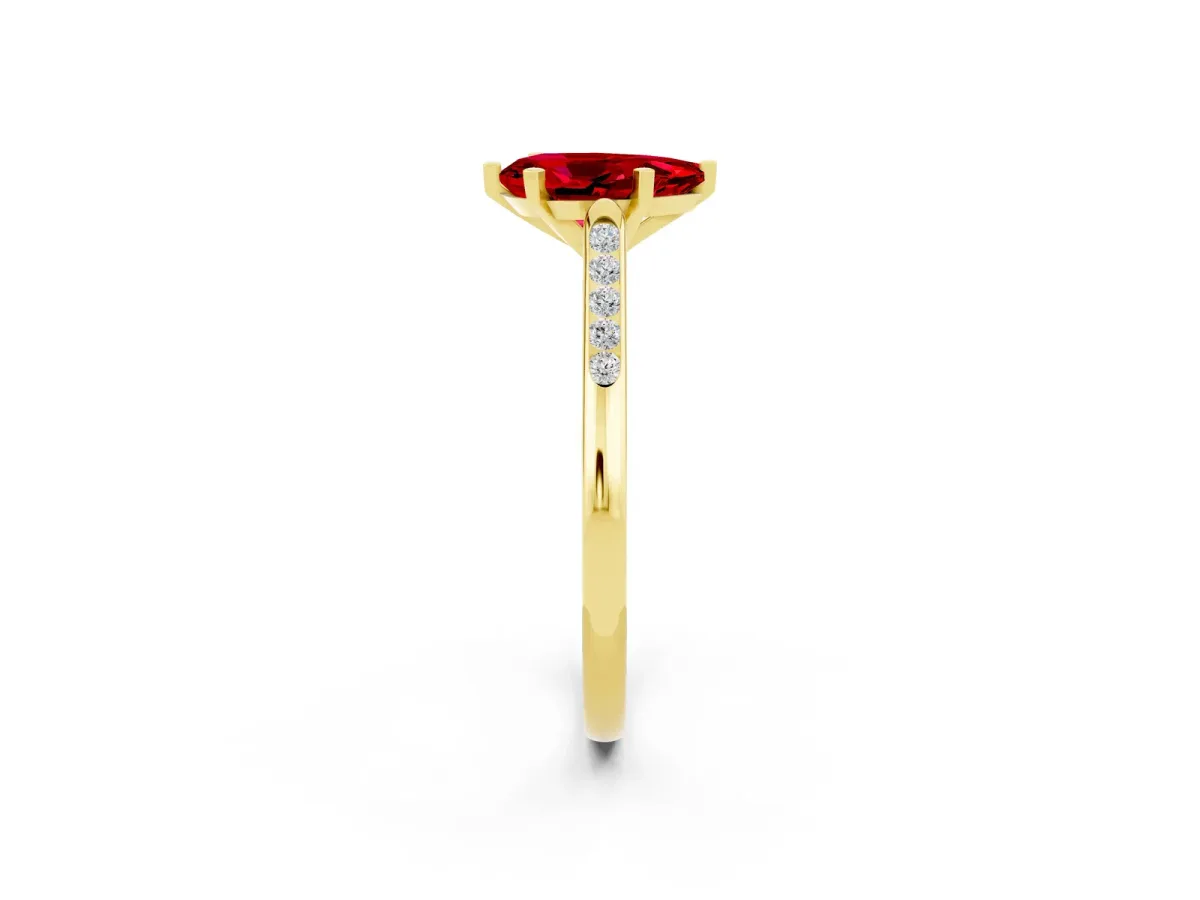 Pear Cut Ruby Solitaire Ring with Channel Set Round Band and Prong Setting Yellow gold