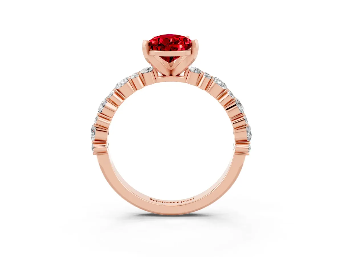 Pear Cut Ruby Side Stone Solitaire Ring with Round and Four-Prong Setting Rose gold