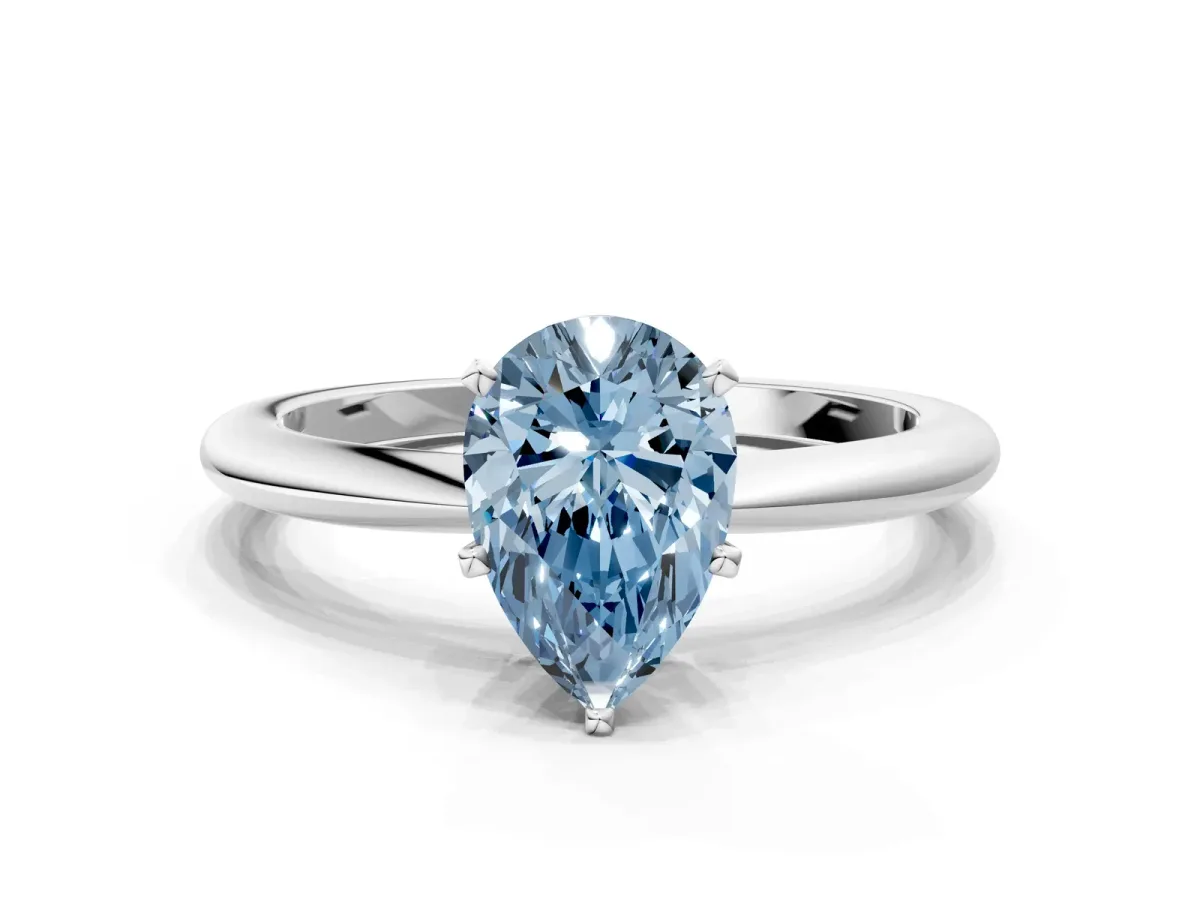 Fancy Blue Pear Cut Diamond Solitaire Ring with Six-Prong Setting and Classic Band Silver