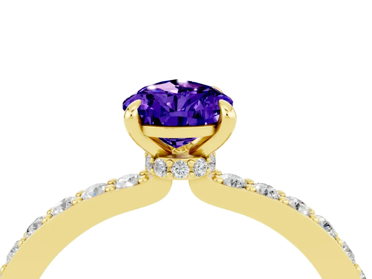Pear Cut Tanzanite Solitaire Engagement Ring with Pavé Band and Four-Prong Setting Yellow gold