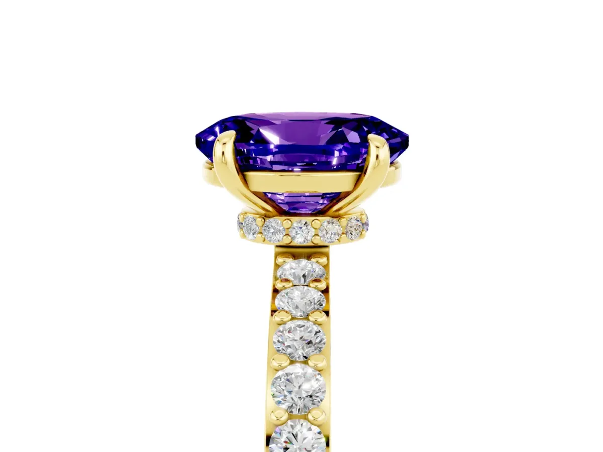 Oval Cut Tanzanite Solitaire Engagement Ring with Pavé Band and Four-Prong Setting Yellow gold
