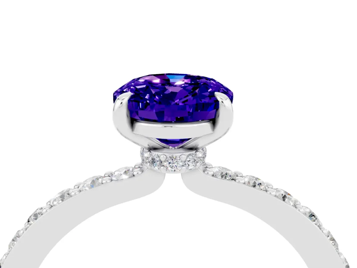 Oval Cut Tanzanite Solitaire Engagement Ring with Pavé Band and Four-Prong Setting Platinum