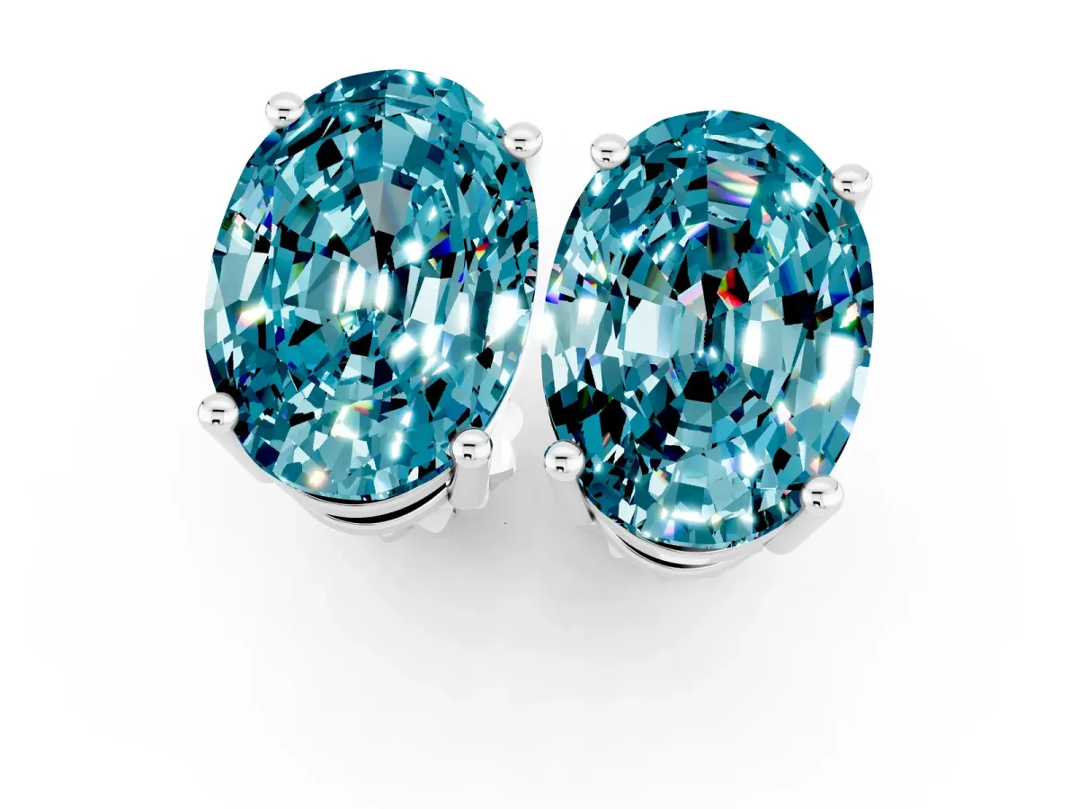 Oval Cut Blue Topaz Stud Earrings White gold