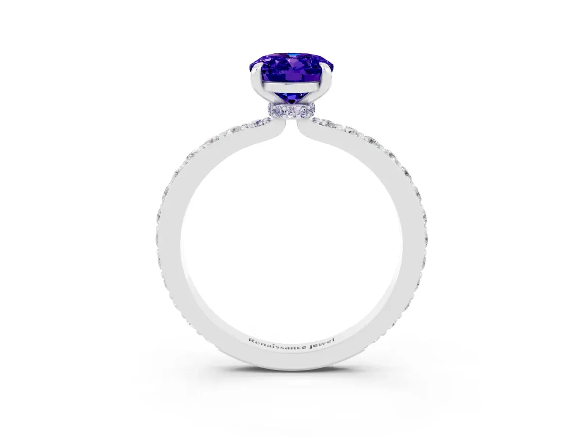 Oval Cut Tanzanite Solitaire Engagement Ring with Pavé Band and Four-Prong Setting Platinum