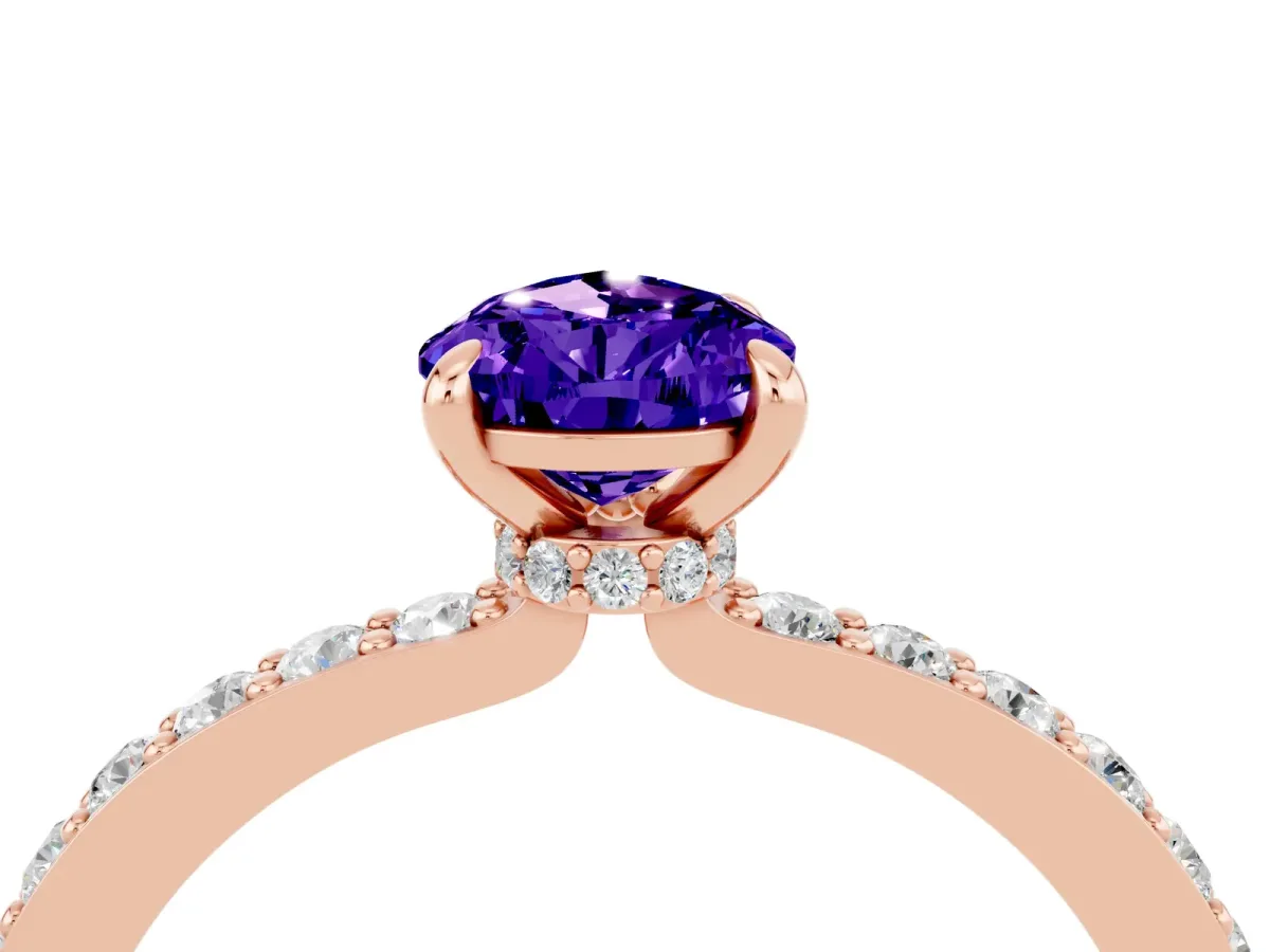 Pear Cut Tanzanite Solitaire Engagement Ring with Pavé Band and Four-Prong Setting Rose gold