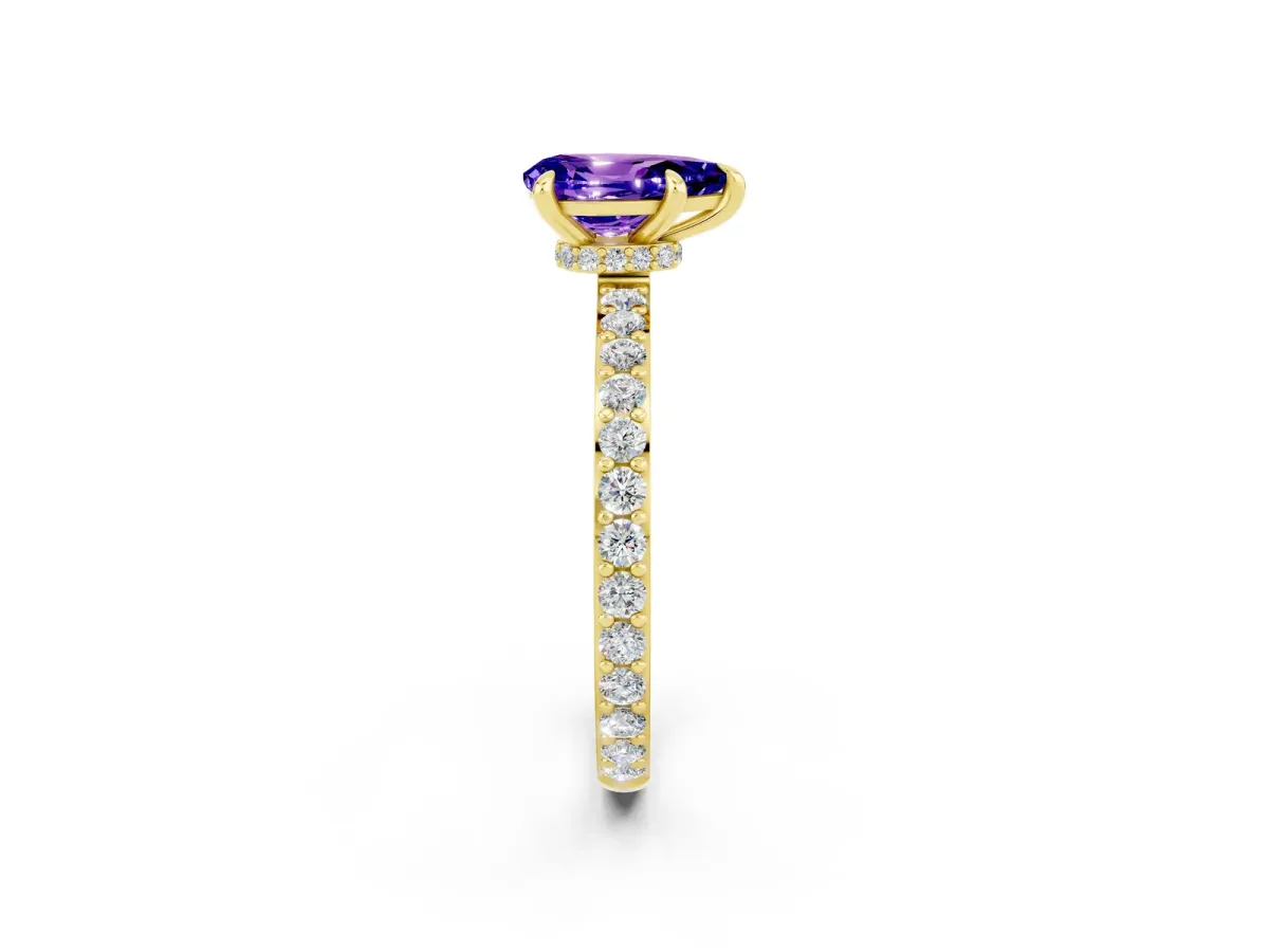 Pear Cut Tanzanite Solitaire Engagement Ring with Pavé Band and Four-Prong Setting Yellow gold