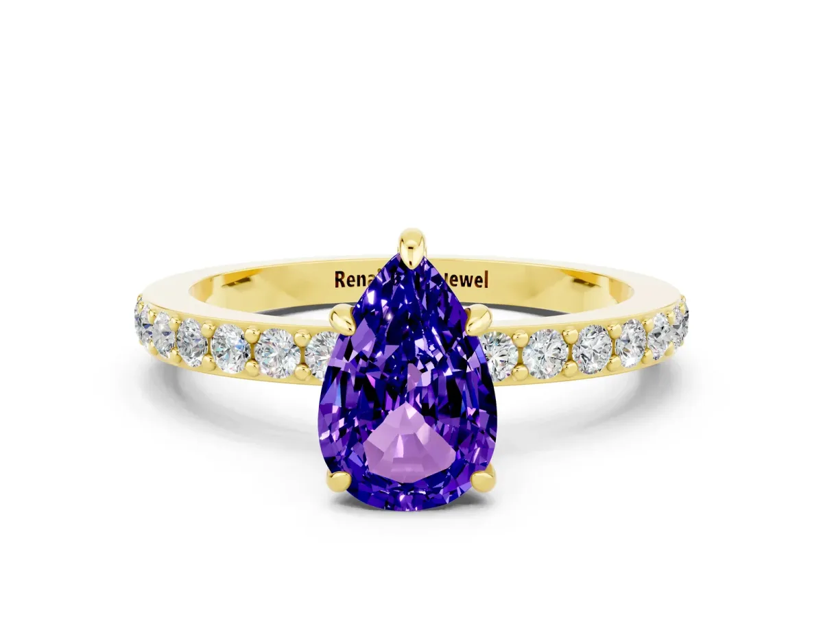 Pear Cut Tanzanite Solitaire Engagement Ring with Pavé Band and Four-Prong Setting Yellow gold