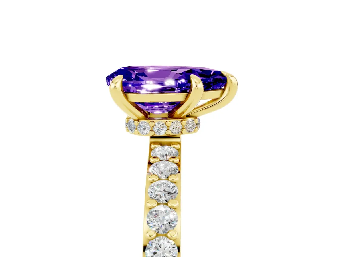 Pear Cut Tanzanite Solitaire Engagement Ring with Pavé Band and Four-Prong Setting Yellow gold