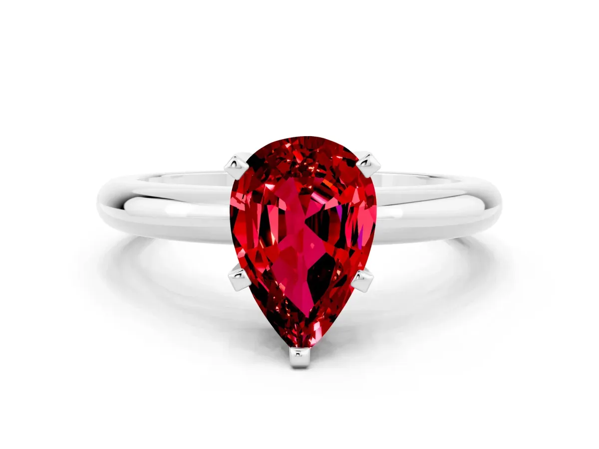 Pear Cut Ruby Solitaire Engagement Ring with Round Band and Four-Prong Setting Silver